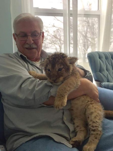 Bob holding a cub. - 2016